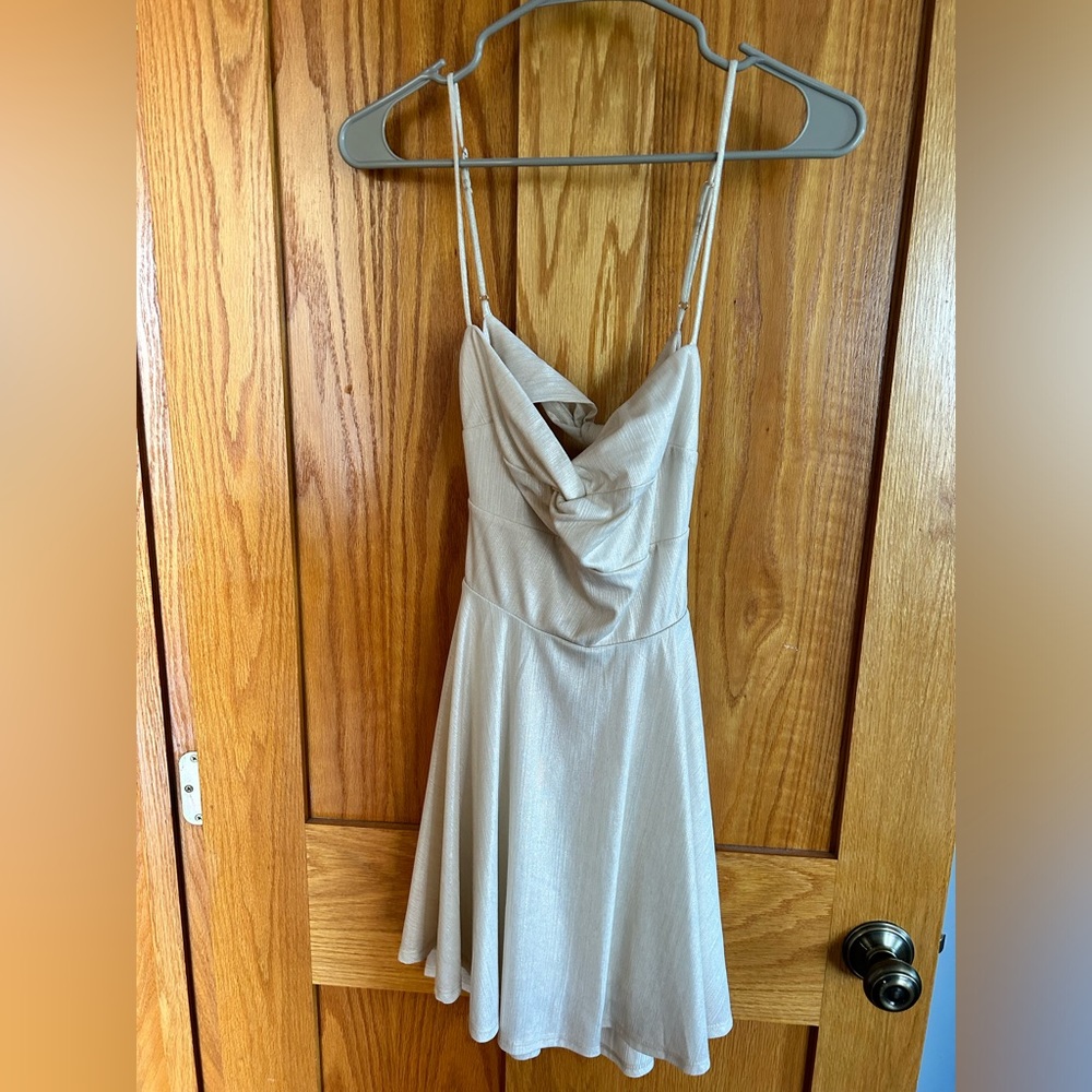 Lucy in the Sky. Cute gold-ish white mini dress with two ties in the back